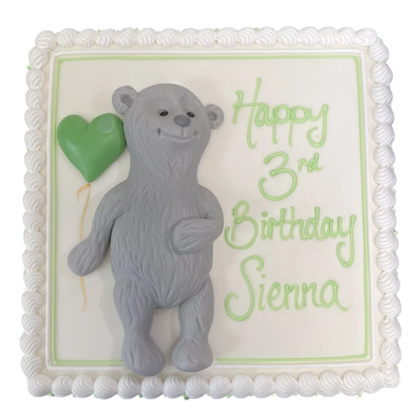 Adorable grey bear cake with a balloon, perfect for birthdays and celebrations. Ideal for animal lovers and children's parties.