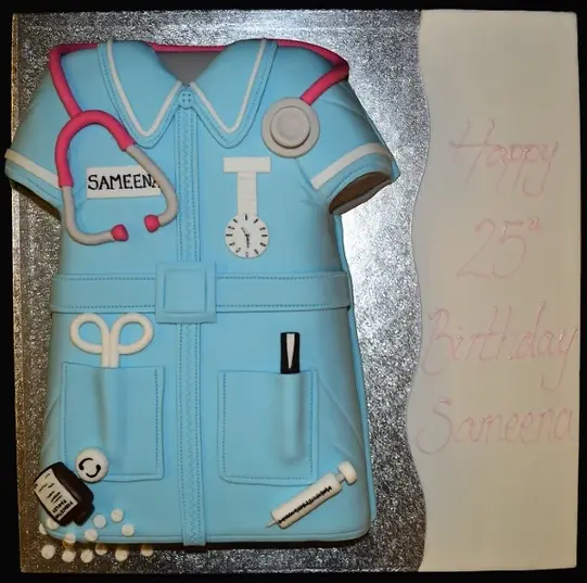 Bespoke nurse uniform cake with detailed fondant stethoscope and badge, crafted for celebration in Solihull, West Midlands.
