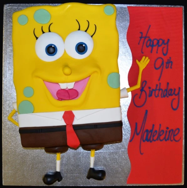 A whimsical SpongeBob SquarePants themed cake with vibrant yellow icing and iconic character decoration. Perfect for fans of the popular cartoon series.
