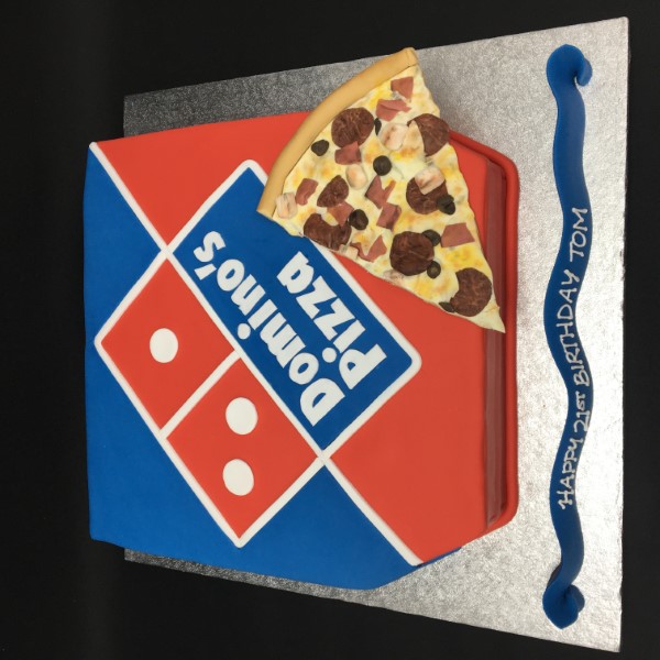 A colourful and creative pizza-shaped cake with vibrant toppings, perfect for pizza lovers and themed parties.