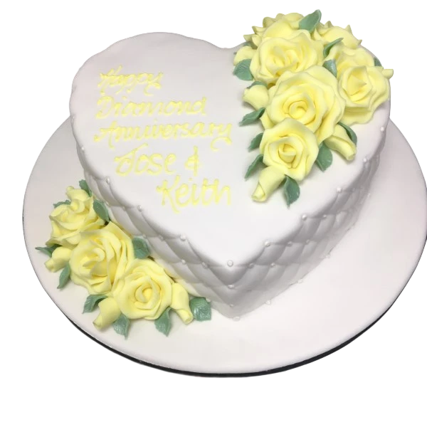 Bespoke quilted heart-shaped cake adorned with delicate roses, crafted in Solihull, West Midlands for celebration.