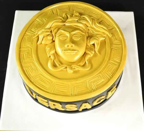 Bespoke Versace-themed cake with gold accents and intricate patterns, crafted in Solihull, West Midlands.
