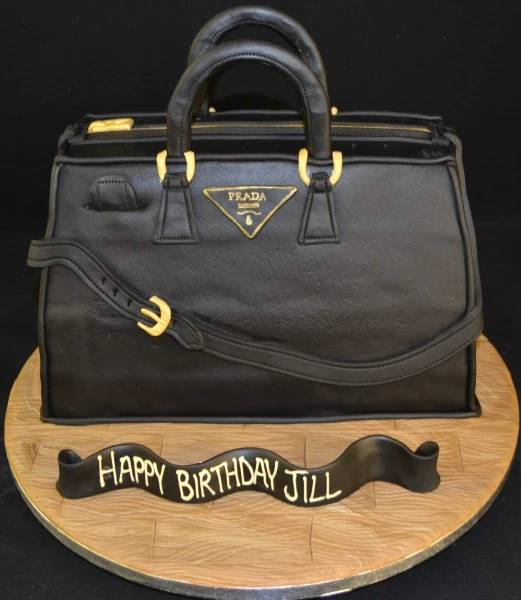 Bespoke 3D Prada handbag cake with intricate detailing, crafted for a celebration in Solihull, West Midlands.