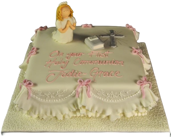 Bespoke Communion cake with white icing and delicate floral decorations, crafted in Solihull, West Midlands.