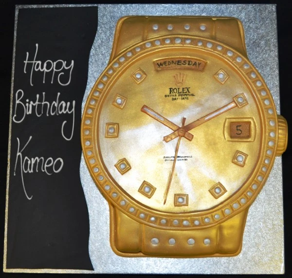 Bespoke gold Rolex cake with detailed watch face design, crafted for celebration in Solihull, West Midlands.