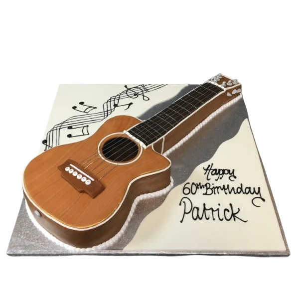 A creative and beautifully designed acoustic guitar-shaped cake, perfect for music lovers and special occasions in UK.
