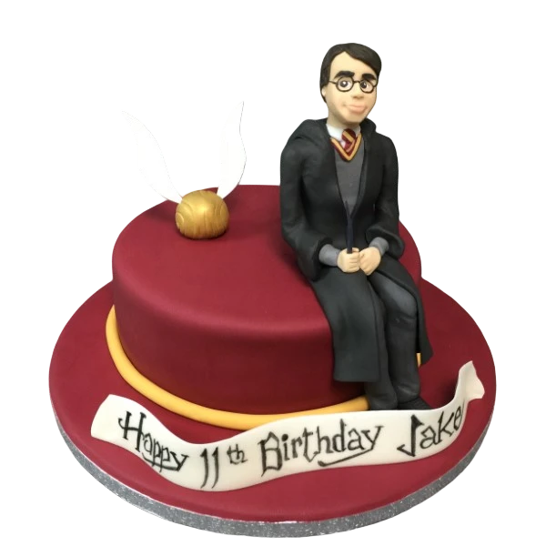 Bespoke Harry Potter-themed cake with Hogwarts crest and magical symbols, crafted in Solihull, West Midlands.