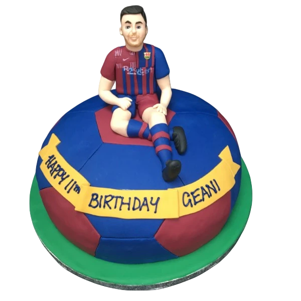 Bespoke Barcelona football cake with detailed footballer figure, perfect for celebration in Solihull, West Midlands.