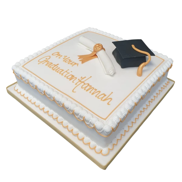 A beautifully decorated graduation cake with a mortar board and scroll design, perfect for celebrating academic achievements.