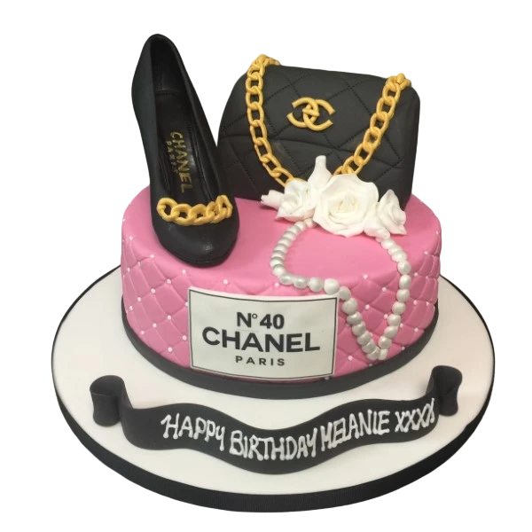 Bespoke Chanel No.40 cake with elegant black and white design, gold accents, and Solihull, West Midlands celebration theme.