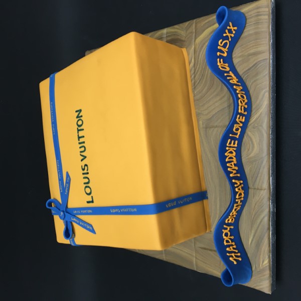 Luxurious Louis Vuitton-inspired designer cake, perfect for fashion lovers. Featuring intricate details and a stylish design that is sure to impress.