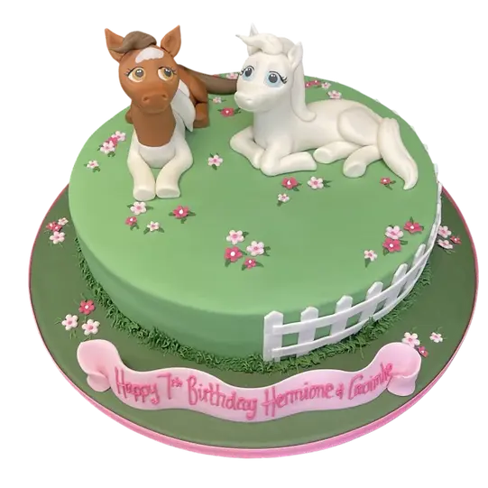 Bespoke celebration cake featuring colorful cute pony horses, decorated with fondant in Solihull, West Midlands.