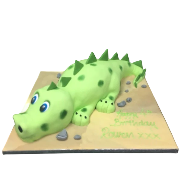 Bespoke cute dinosaur cake with green fondant and colorful spikes, crafted for celebration in Solihull, West Midlands.