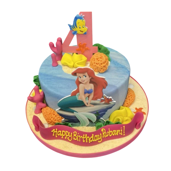 Bespoke Little Mermaid Ariel and Flounder cake with colorful corals for celebration in Solihull, West Midlands.