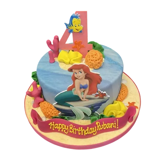 Bespoke Little Mermaid Ariel and Flounder cake with coral decorations, crafted for celebration in Solihull, West Midlands.