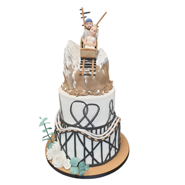 Three-tier wedding cake with roller coaster design and sugar paste flowers.