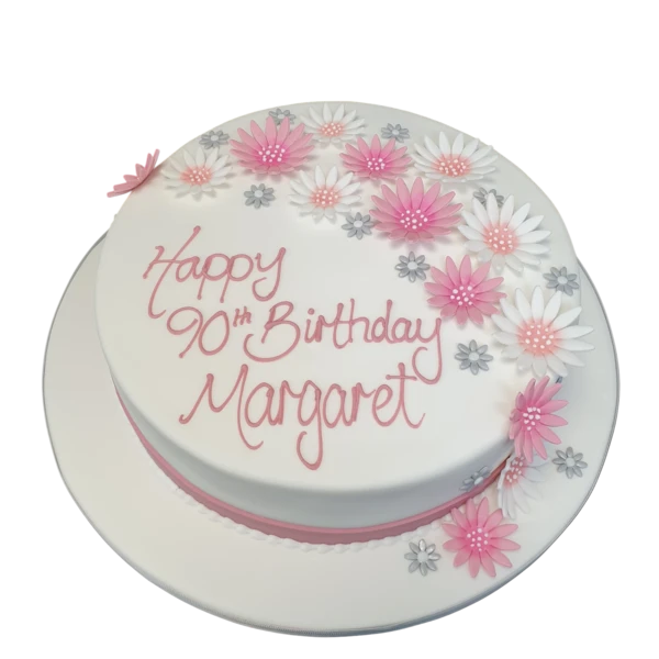 Beautiful daisy cake with intricate sugar flower decorations, perfect for birthdays or special occasions.