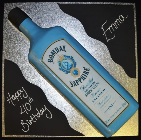Bespoke cake shaped like a Bombay Gin bottle with detailed label, crafted for celebration in Solihull, West Midlands.