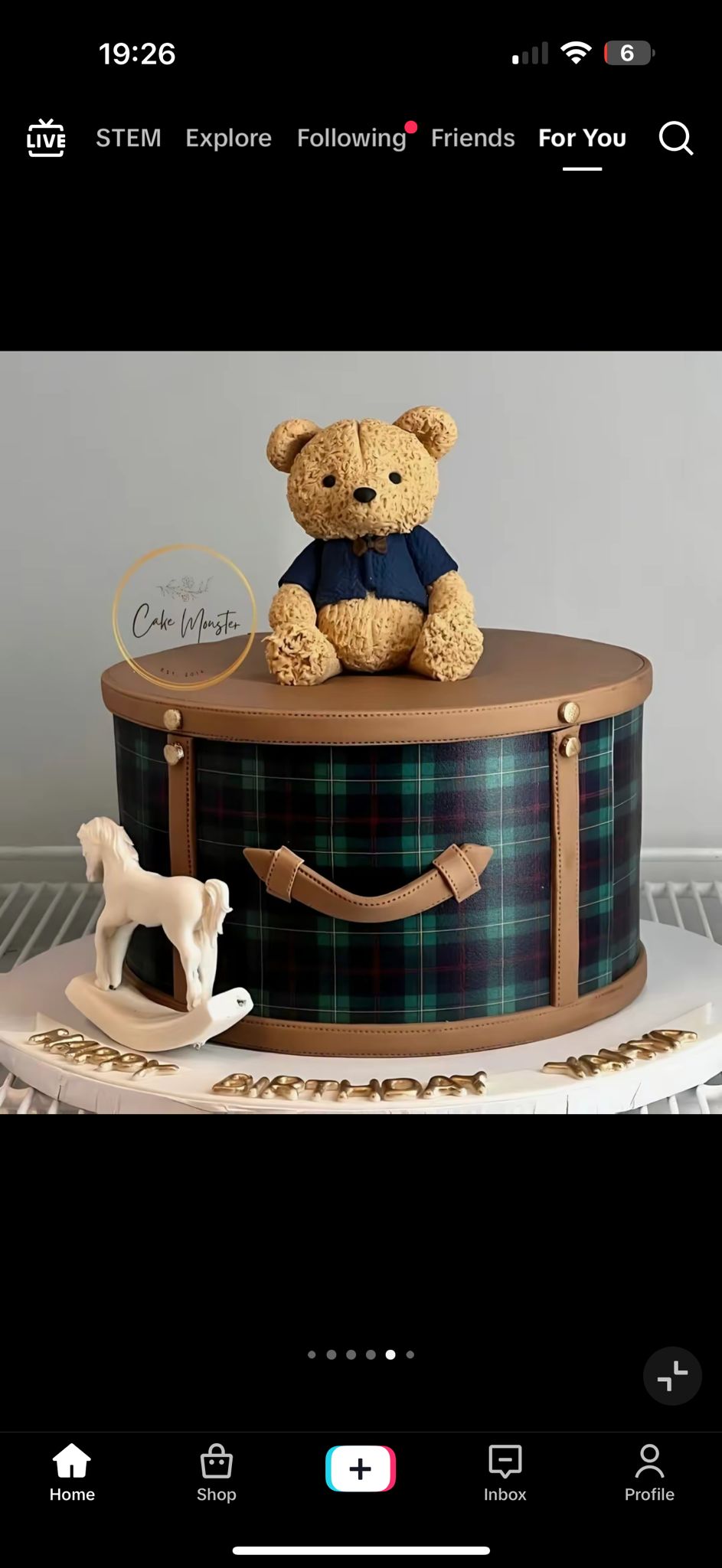 Bespoke celebration cake with intricate floral designs and gold accents in Solihull, West Midlands.