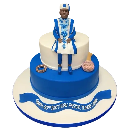 Bespoke cake in Solihull, West Midlands featuring an African traditional dress man holding musical instruments for celebration.