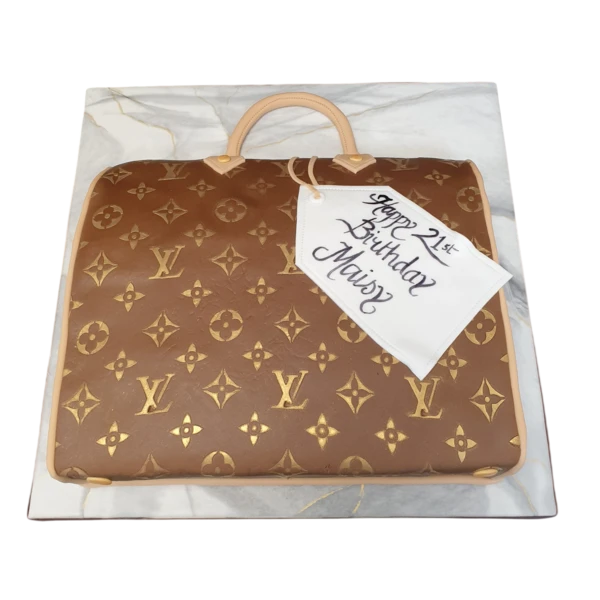 Bespoke Louis Vuitton handbag 2D cake with detailed logo design, crafted for celebration in Solihull, West Midlands.