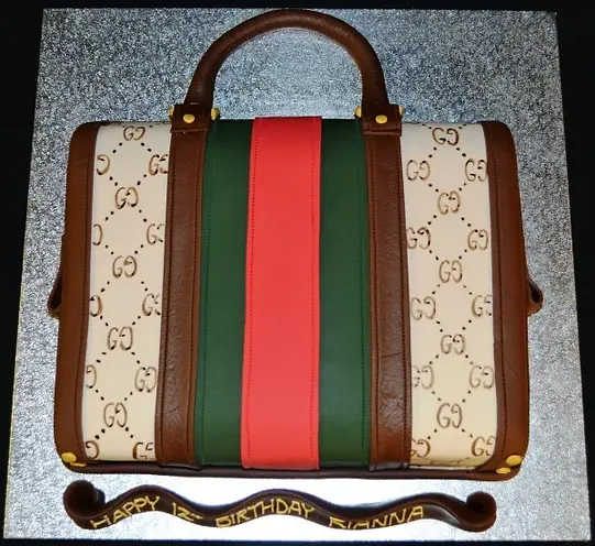 Bespoke Gucci handbag 2D cake with detailed logo design, crafted for a celebration in Solihull, West Midlands.