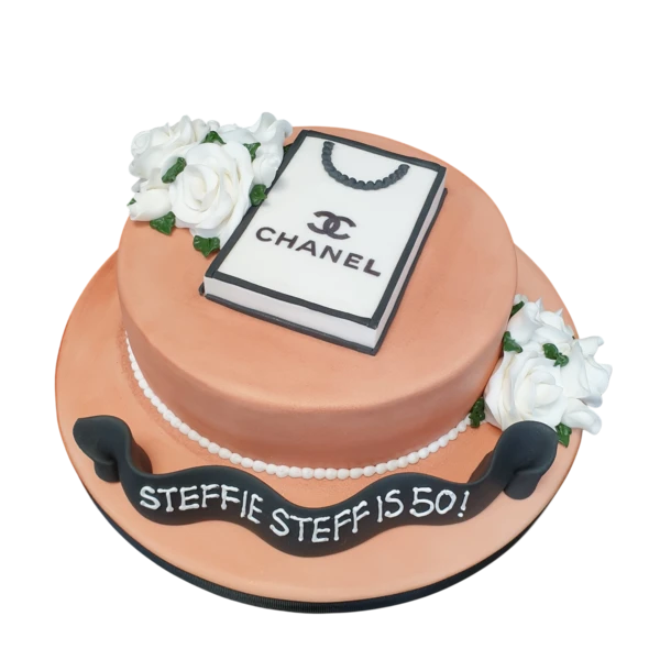 Bespoke Chanel-themed cake with quilted fondant and edible pearls, crafted in Solihull, West Midlands.