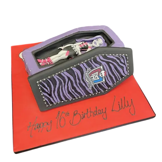 Bespoke Monster High coffin cake featuring Spectra Vondergeist design, crafted for celebration in Solihull, West Midlands.