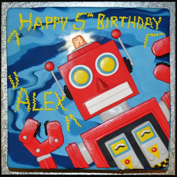 Bespoke robot-themed cake with square tiers, detailed gears, and metallic accents in Solihull, West Midlands.