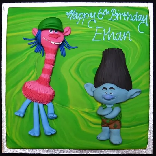 Bespoke Trolls-themed celebration cake with vibrant characters and colorful icing in Solihull, West Midlands.