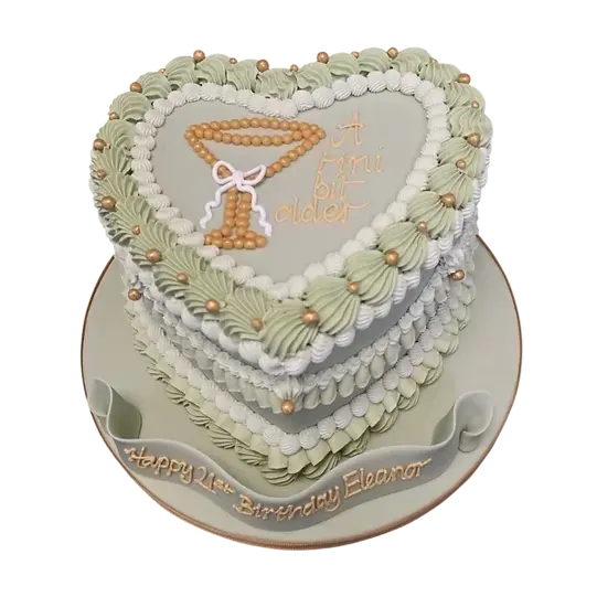 Bespoke heart-shaped cake with chunky fancy piping shells in royal icing, crafted in Solihull, West Midlands.