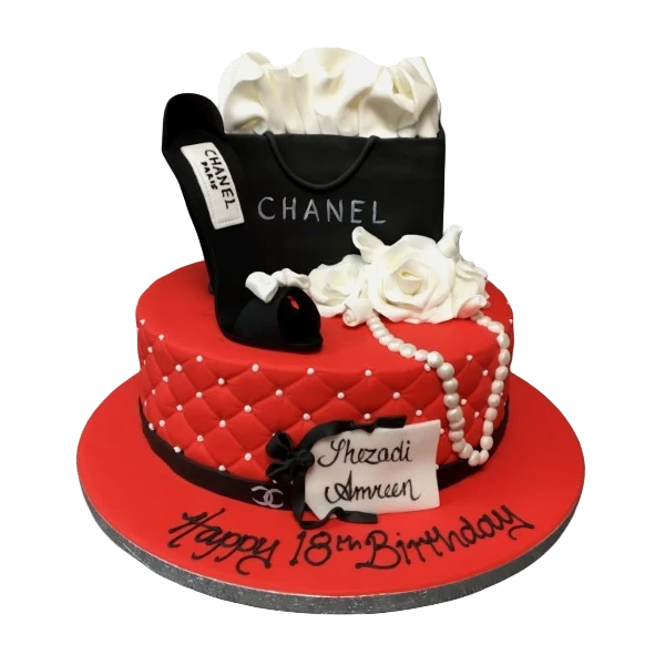 Bespoke Chanel-themed cake with black and white fondant details, pearls, and Solihull, West Midlands celebration design.