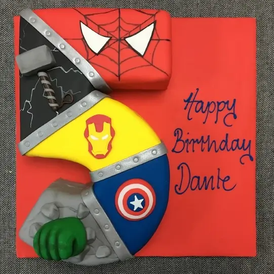 Bespoke Avengers-themed number cake with colorful superhero decorations in Solihull, West Midlands.