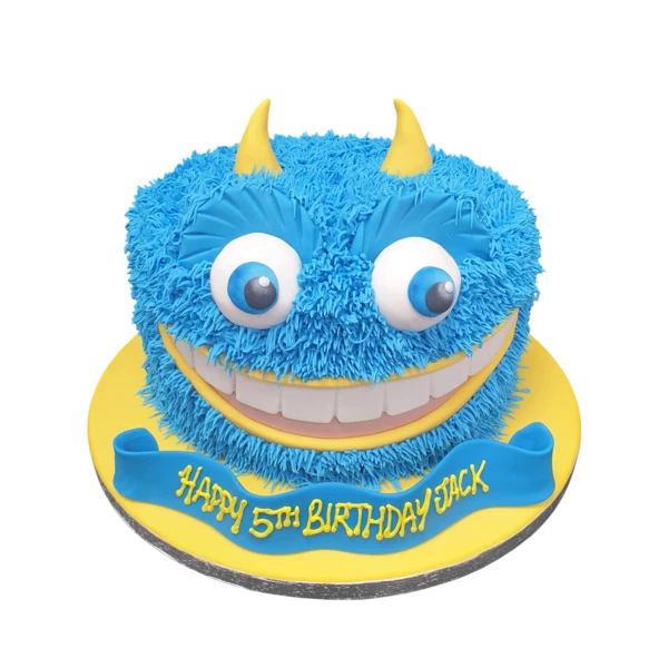 Bespoke fluffy monster cake with colorful fondant eyes and teeth, perfect for celebration in Solihull, West Midlands.