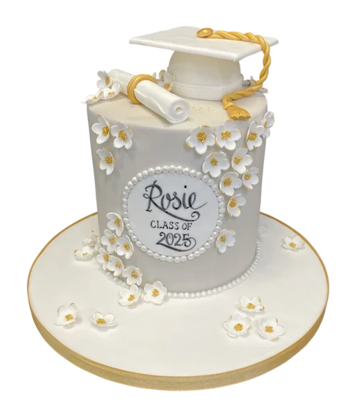 A beautifully decorated graduation cake adorned with delicate fondant blossoms, perfect for celebrating academic achievements in style.