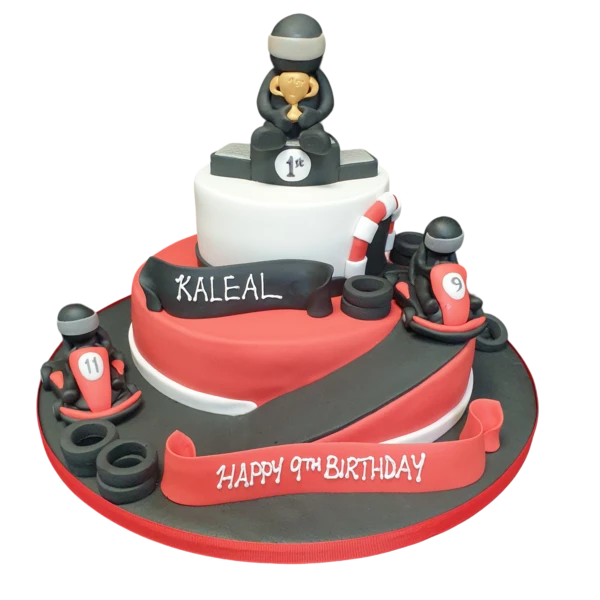 Bespoke go-karting themed cake with edible race track and miniature karts, crafted in Solihull, West Midlands.