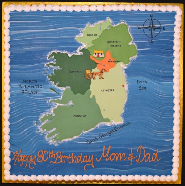 Bespoke cake shaped like Ireland map with detailed green and white icing, crafted in Solihull, West Midlands.