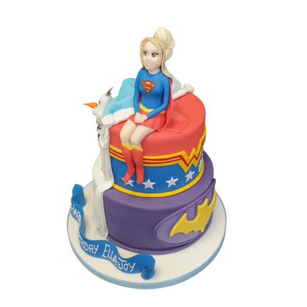 A split frozen superhero-themed cake with vibrant colors and fun designs, perfect for a special celebration.