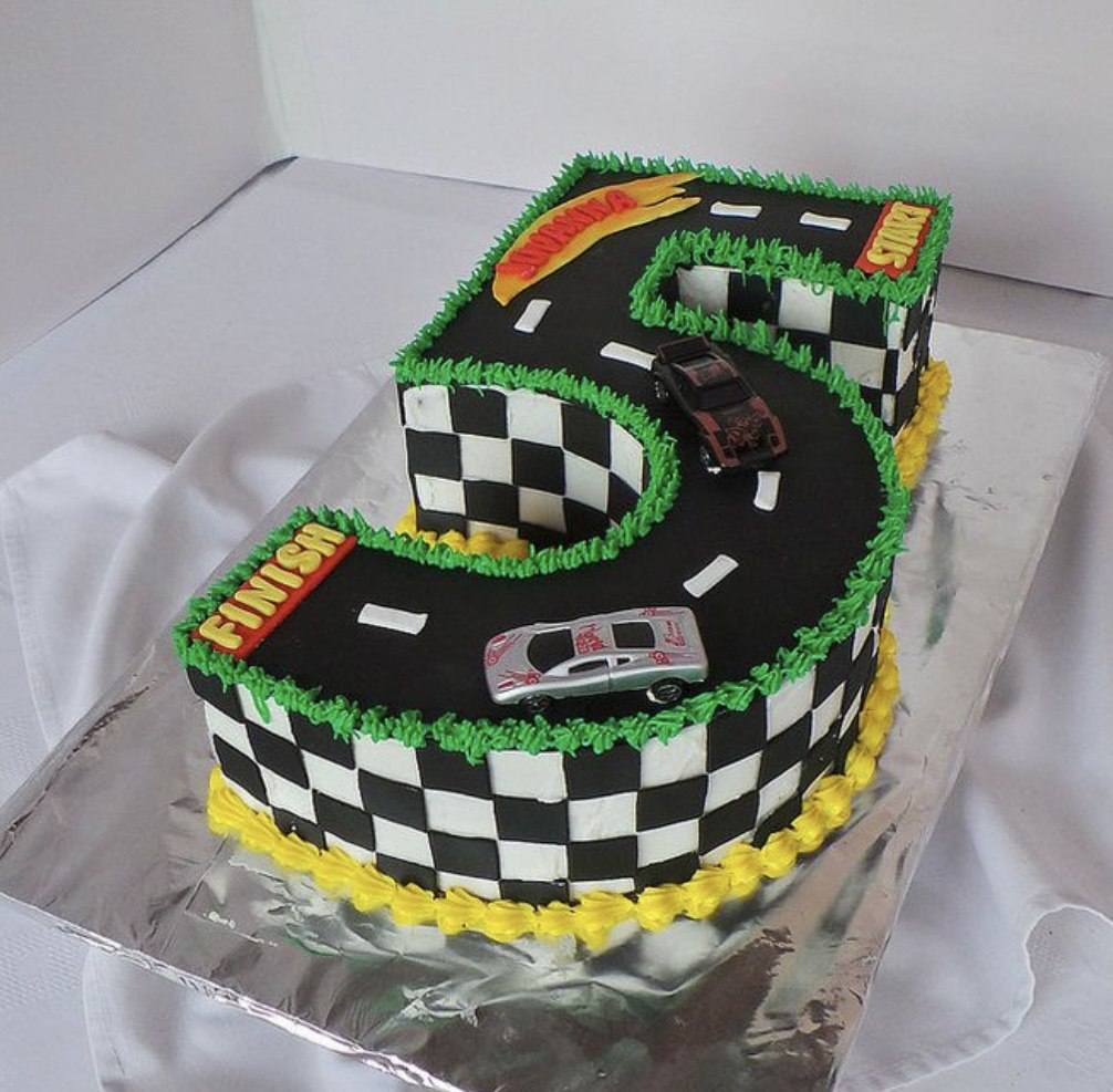 Bespoke celebration cake with intricate floral icing and gold accents in Solihull, West Midlands.