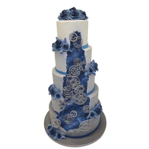 Five-tier wedding cake with blue roses and intricate sugar paste designs.