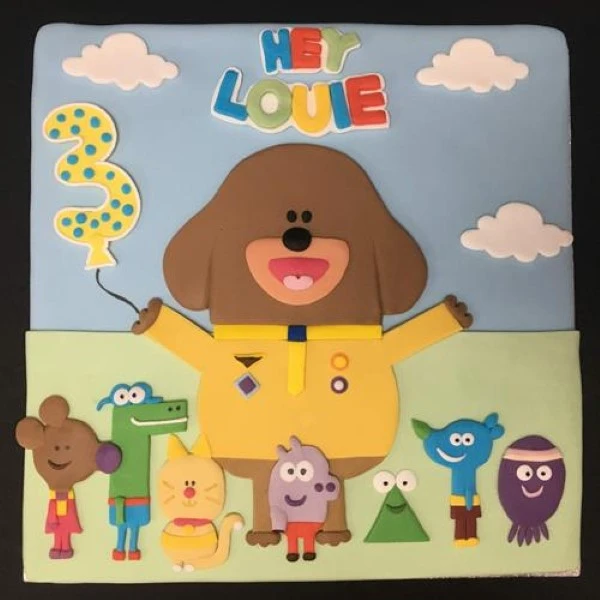 Bespoke square cake with colorful fondant decorations celebrating Hey Duggee in Solihull, West Midlands.