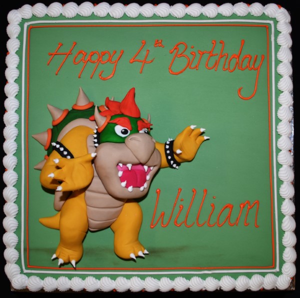 Bespoke square cake featuring Bowser from Super Mario, decorated with vibrant colors in Solihull, West Midlands.