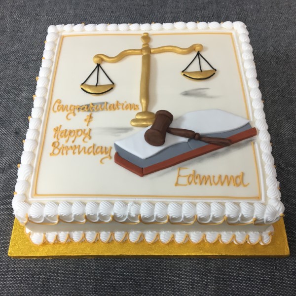 Bespoke Law Grad cake with scales of justice and diploma design, crafted in Solihull, West Midlands.