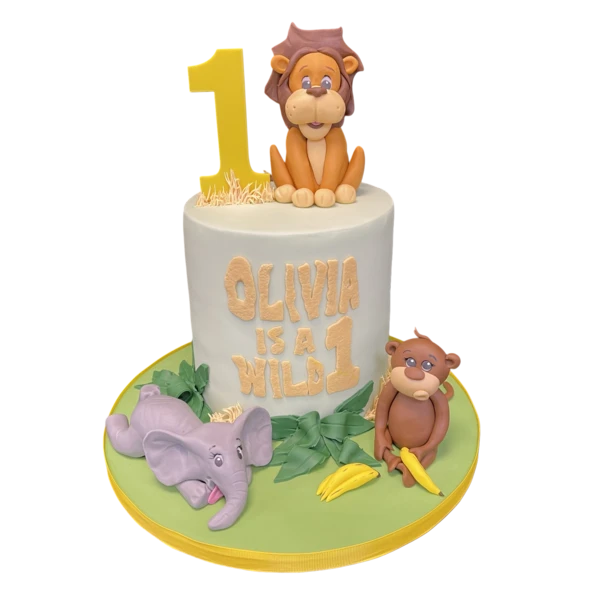 A vibrant and playful Wild One Safari Animals cake featuring cute animal decorations, perfect for a fun and adventurous celebration.