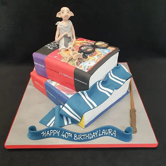 Bespoke Harry Potter book-themed cake with Dobby figure, crafted for celebration in Solihull, West Midlands.