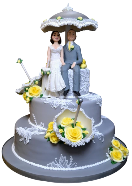 Three-tier grey wedding cake with yellow sugar roses and bride and groom figures.