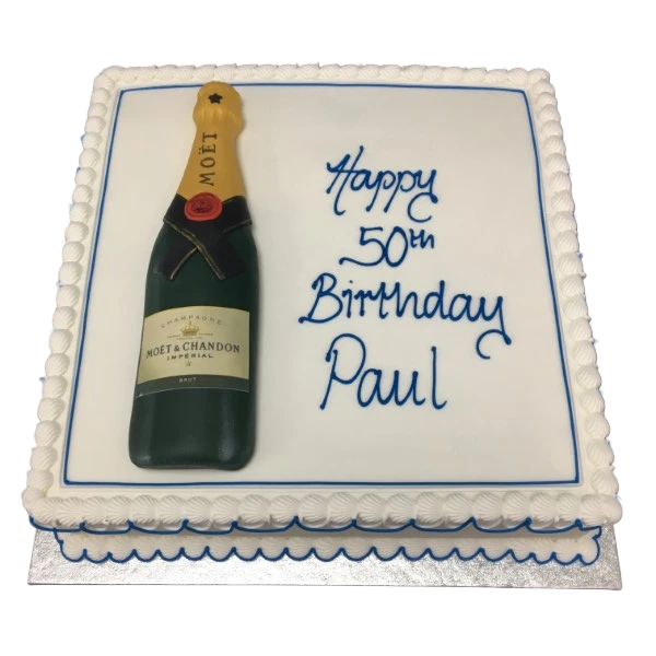 Bespoke celebration cake shaped like a champagne bottle with gold and green details in Solihull, West Midlands.