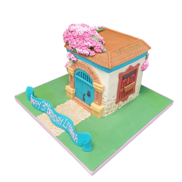 Bespoke Encanto House cake with vibrant colors and detailed decorations, crafted in Solihull, West Midlands.
