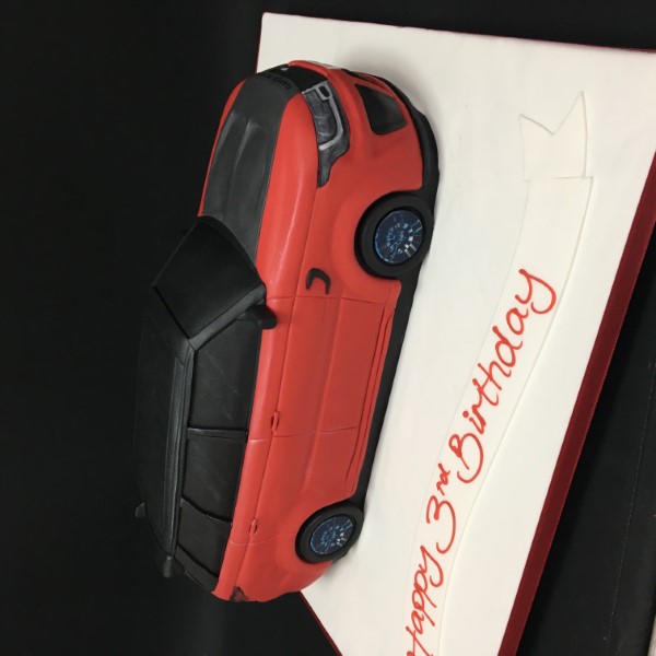 Bespoke Range Rover Sport SVR cake with detailed car design, displayed in Solihull, West Midlands celebration.