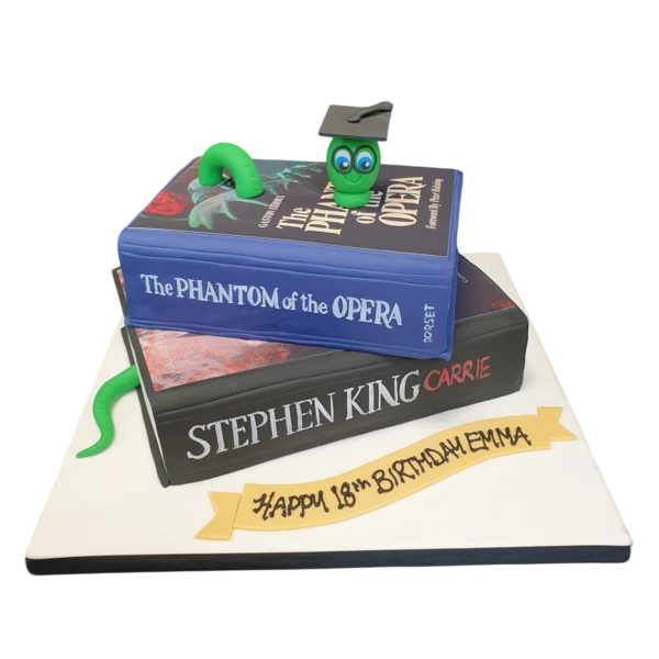 A unique and creative cake designed to look like a stack of books, perfect for book lovers and bookworms. Ideal for literary-themed events or celebrations.